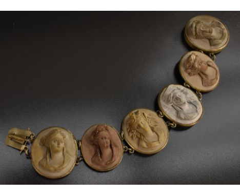 A late 19th /early 20th century six panel Lava cameo portrait bracelet, each individual panel carved as a different Greco Rom