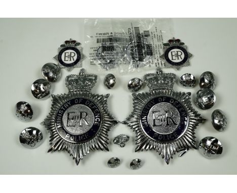 Two QEII Ministry of Defence Police helmet plates, four cap badges and tunic buttons