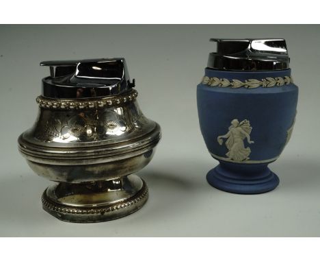 An electroplate table lighter having chased foliate decoration, together with a Wedgwood Jasperware table lighter