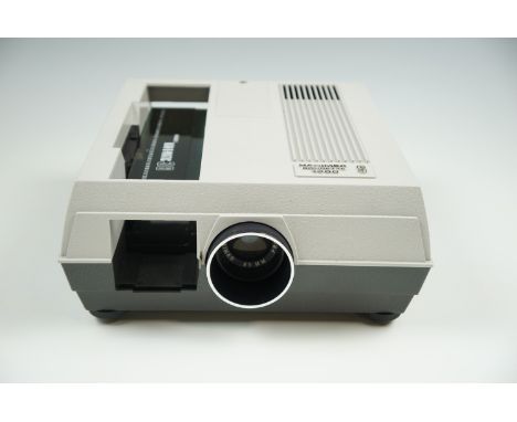 A boxed Hanimex 'Rondette 1000S' 35mm slide projector with original instructions