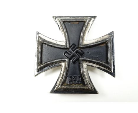 A German Third Reich Iron Cross first class, its pin stamped "107"