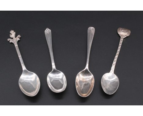 Four silver teaspoons comprising, cast rope twist design stem with a long-ship featuring on the terminal, Chester, 1954, a si