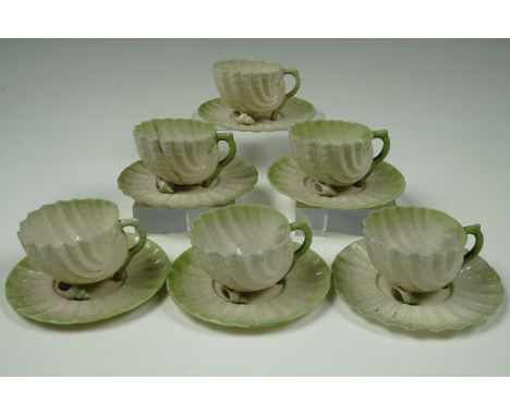 A Belleek "Neptune" shell-form tea / coffee set, comprising six cups with saucers, latter 11 cm, late 19th / early 20th Centu