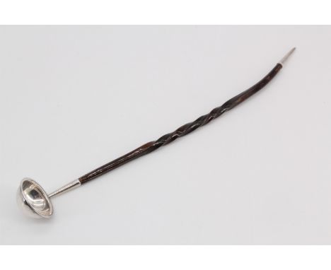 An unusual late 19th Century silver toddy ladle, formed as a small hemispherical bowl with an everted rim on a twisted baleen