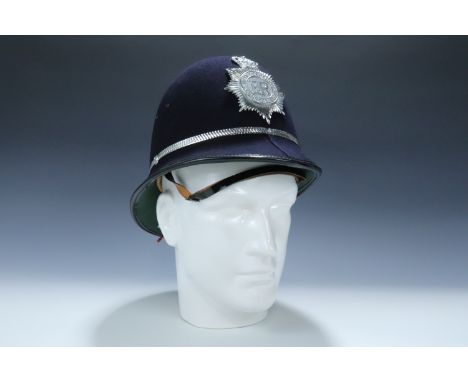 A West Yorkshire police Custodian helmet, with a queen's crown