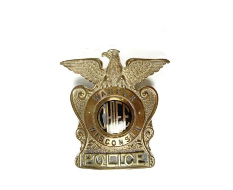 American police cap badge, Wisconsin Chief of Police, Waupon Police Dept., brass with central brass and enamel inset bearing 