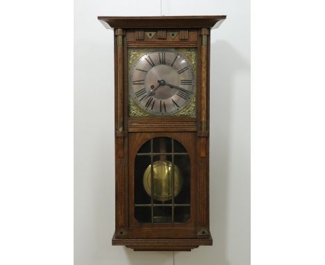 A late 19th / early 20th Century Jugendstil influenced oak cased wall clock, 70 x 28 x 14 cm