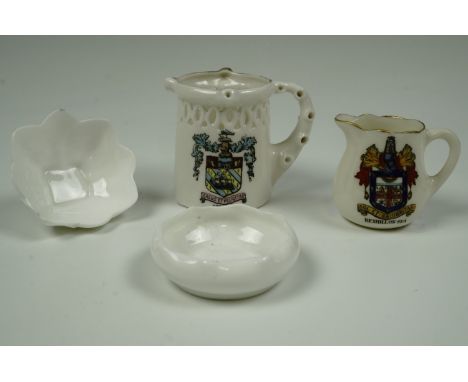 Two miniature Doulton Burslem ceramic dishes together with two items of crested ware, tallest 5.5 cm