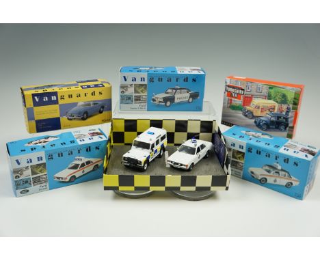 Four boxed Vanguard's diecast models, comprising police cars, and 'Yorkshire Tea', and Corgi limited edition diecast set, com
