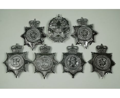 A collection of British police helmet plates, comprising varied designs of North Yorkshire Police, and a Leeds Police plate