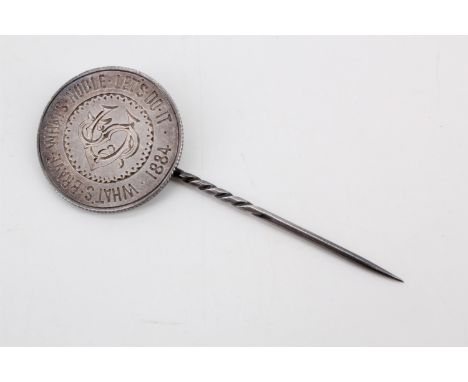 A stick pin formed from a young head Victoria shilling with its reverse face polished and engraved "What's Brave, What's Nobl