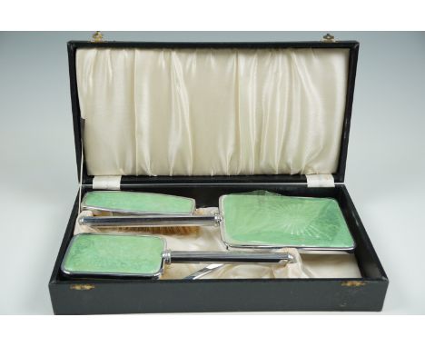 A cased dressing table set, in chrome plate and faux green guilloche enamel, circa 1940s