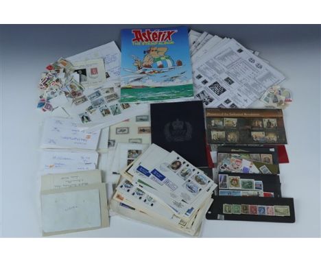 A box file containing an eclectic assortment of philatelic material, including a mint 1933 centenary of British occupation Fa