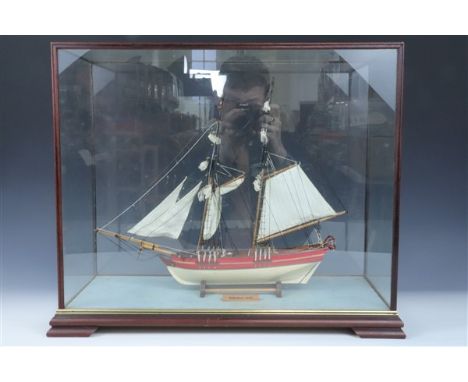 A scale model 1812 Schooner, in glazed display case, 54 x 26 cm