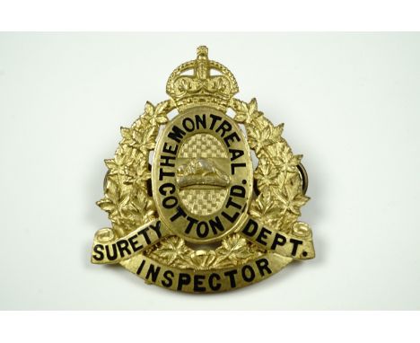 A gilt metal and enamel cap badge for "The Montreal Cotton Ltd Surety Department Inspector", formed as a wreath of maple leav