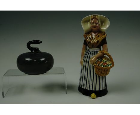 A Beneagles Whiskey ceramic decanter in the form of a curling stone by Peter Thomas (Perth) together with a Bols figural deca