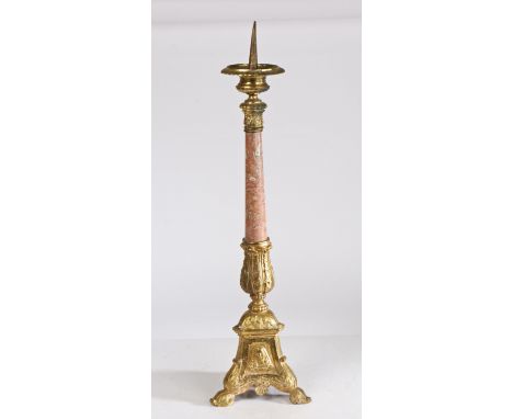 A 18th century style gilt metal pricket candlestick, having a gadrooned flange above a acanthus leaf and rouge marble column 