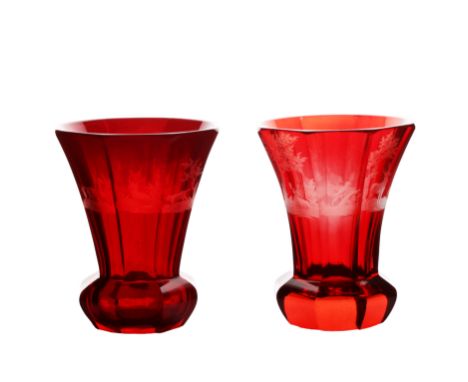 Two mid 19th Century Bohemian ruby glass flared beakers, the first engraved with horses, stags and dogs, the second with stag