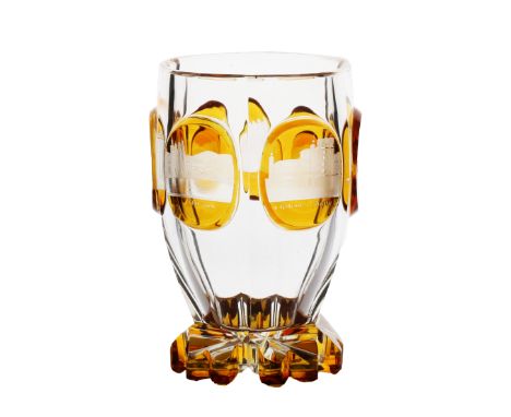 A mid 19th Century Bohemian beaker, circa 1860, with amber panels engraved with views of Baden, one initialled AK, 12cm high