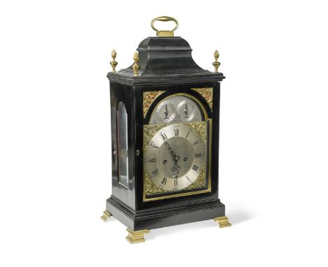 the inverted bell top case with folding handle and four brass flambeau finials, the silvered 18cm dial signed above 'R. Darli