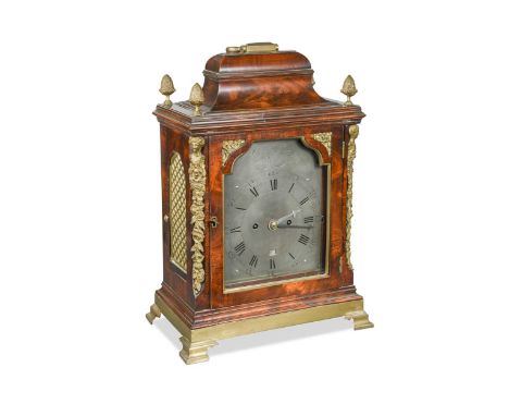 the inverted bell top case with handle and four pineapple finials, above 7inch (18cm) silvered dial, signed in the arch 'Chas