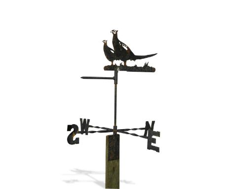 the pointer depicting two pheasants with twisted wrought iron compass points below, twentieth century,74 cm high(excluding wo