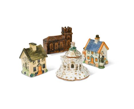 flanked by two figures, 12.5cm high; another cottage money box, 11.5cm high; an unusual 19th century brown glazed pottery mon