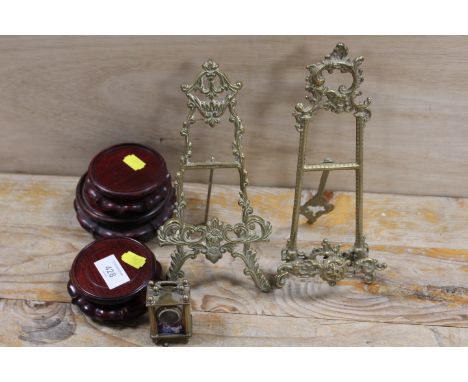 A MINIATURE CARRIAGE CLOCK TOGETHER WITH TWO ORNATE BRASS STYLE EASEL BACK PICTURE FRAMES ETC