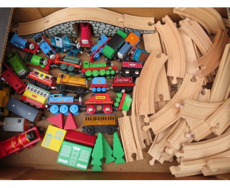 A SELECTION OF BRIO AND EARLY LEARNING CENTRE THOMAS THE TANK ENGINE LOCOMOTIVES AND TRACK