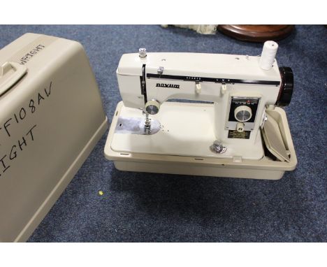 A VINTAGE CASED VOVUM SEWING MACHINE 