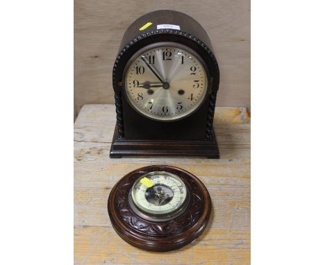 A VINTAGE DOMED MANTLE CLOCK TOGETHER WITH A SMALL WALL MOUNTED BAROMETER 