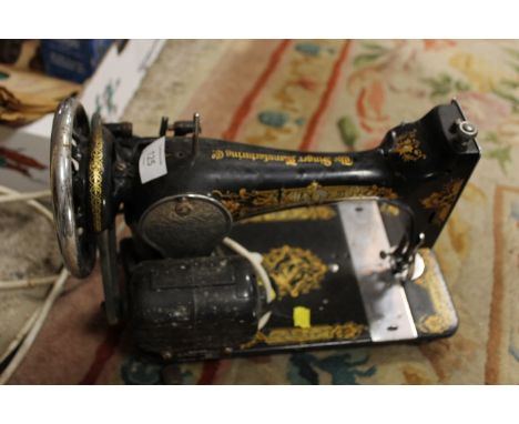 A VINTAGE ELECTRIC SEWING MACHINE (UNCHECKED)