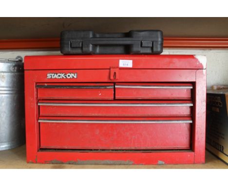 A RED FOUR DRAWER TOOL BOX AND AN AIR CHISEL