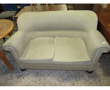 A VINTAGE UPHOLSTERED TWO SEATER SOFA