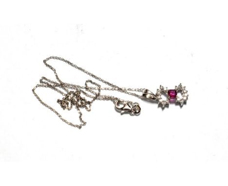A ruby and diamond pendant on chain, pendant length 2cm, chain length 40cm . Pendant stamped '750' and '18K'. Chain stamped 1