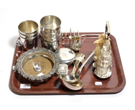 A collection of silver and silver-plate, including: a silver five-bar toast-rack; a silver pear-shaped cream-jug; a silver ob