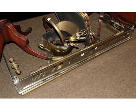 A collection of fire furniture including two folding fire guards; a brass fender; a steel fender; a brass coal helmet; and va