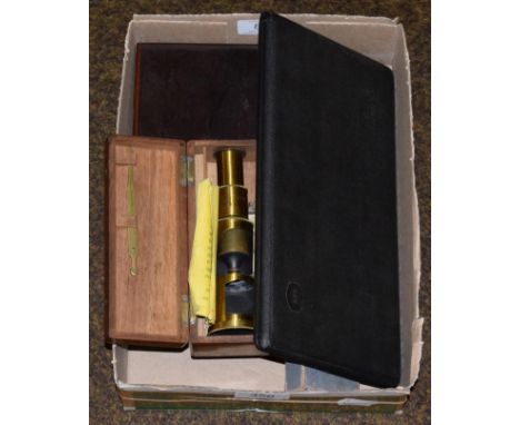 Brass travelling microscope with a few prepared slides (cased) together with two drawing sets and a slide rule