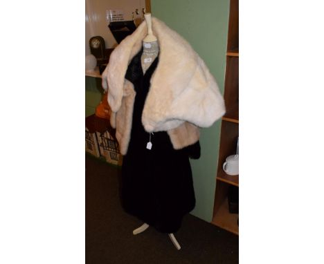 Black fur coat labelled Maxwell Croft, London, together with a modern corset laced mannequin (2)