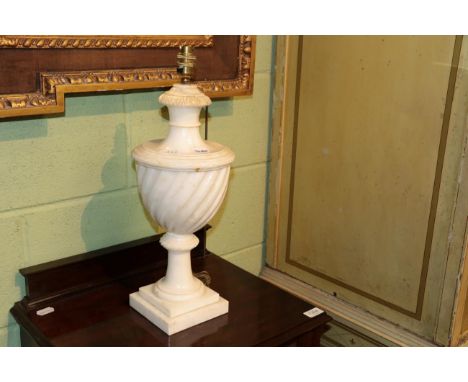 An alabaster table lamp in the form of an urn