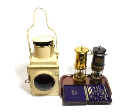 A GWR signal lamp, two miners lamps and a Stanley compass set (4)