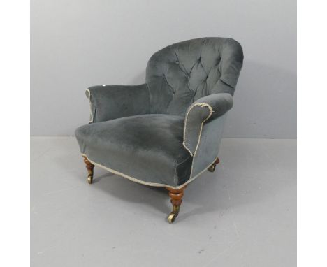 A Victorian mahogany and button-back upholstered spoon-back nursing chair.