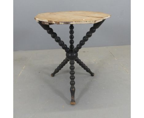 An antique painted pine Gypsy table, the circular top on bobbin turned tripod base. Diameter 52cm, height 65cm.Good condition