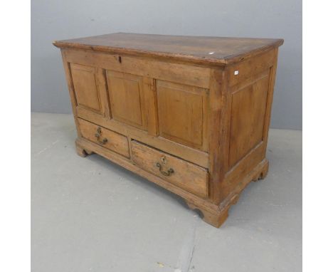 A vintage stained pine blanket box, with lifting lid, two drawers and bracket feet. Width 116cm, height 75cm, depth 52cm.