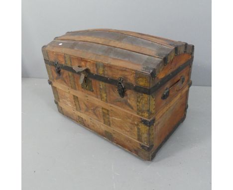 A Victorian leather covered dome-top trunk with fitted interior. Width 82cm, height 65cm, depth 46cm.
