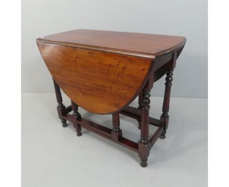 A reproduction mahogany oval gate-leg drop-leaf table. Length 90cm, height 73cm, width 43cm.