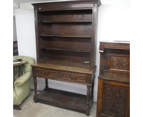 A 19th century two-section oak dresser, the upper section shelved, the lower with two drawers and pot shelf under. Width 122c