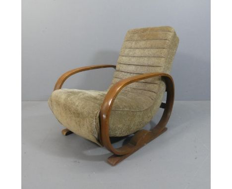 An art deco upholstered lounge chair, with interesting oval design oak arms.