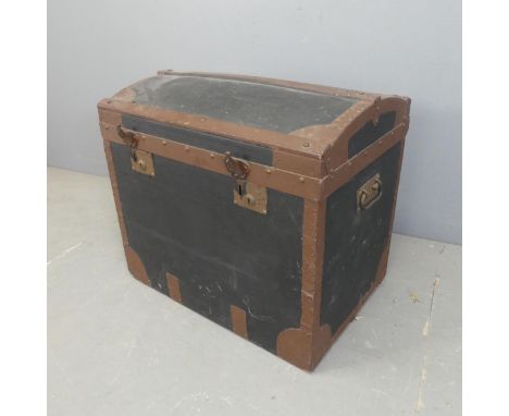 A vintage dome top trunk, with paper for Minshull Bengough. Width 69cm, height 62cm, depth 48cm.