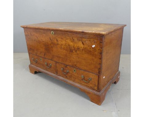 A vintage stained pine blanket box, with lifting lid, two drawers under and raised on bracket feet. Width 112cm, height 67cm,
